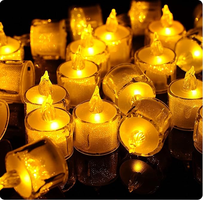 Battery-operated acrylic crystal pattern LED electronic candle lights, rose pattern projection tea candle lights, and flameless candle lights suitable for wedding, holiday, and home decor. PK 24